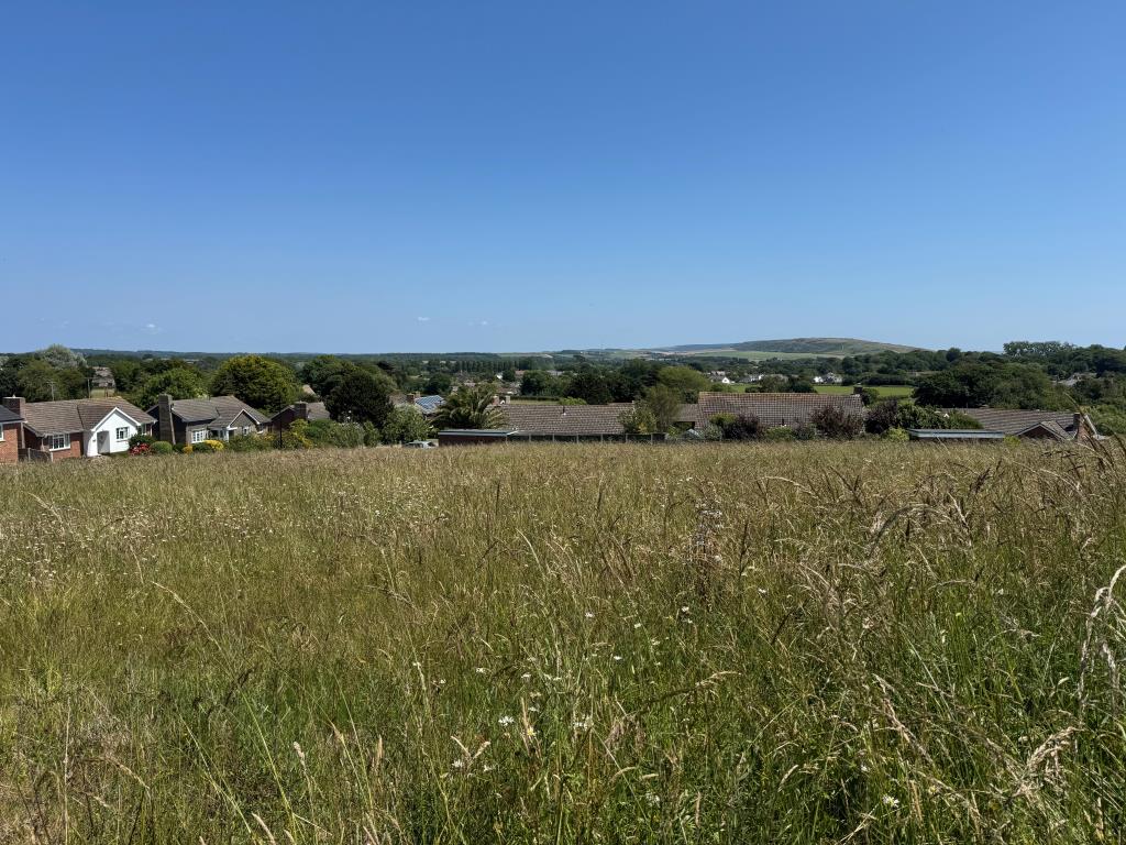 Lot: 33 - OVER THREE-QUARTERS OF AN ACRE FREEHOLD LAND WITH PLANNING FOR SEVEN DETACHED BUNGALOWS - The View from the Top of the Site Towards Afton Down
